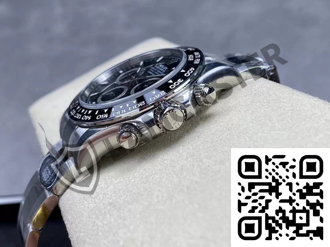 a silver watch with a black face