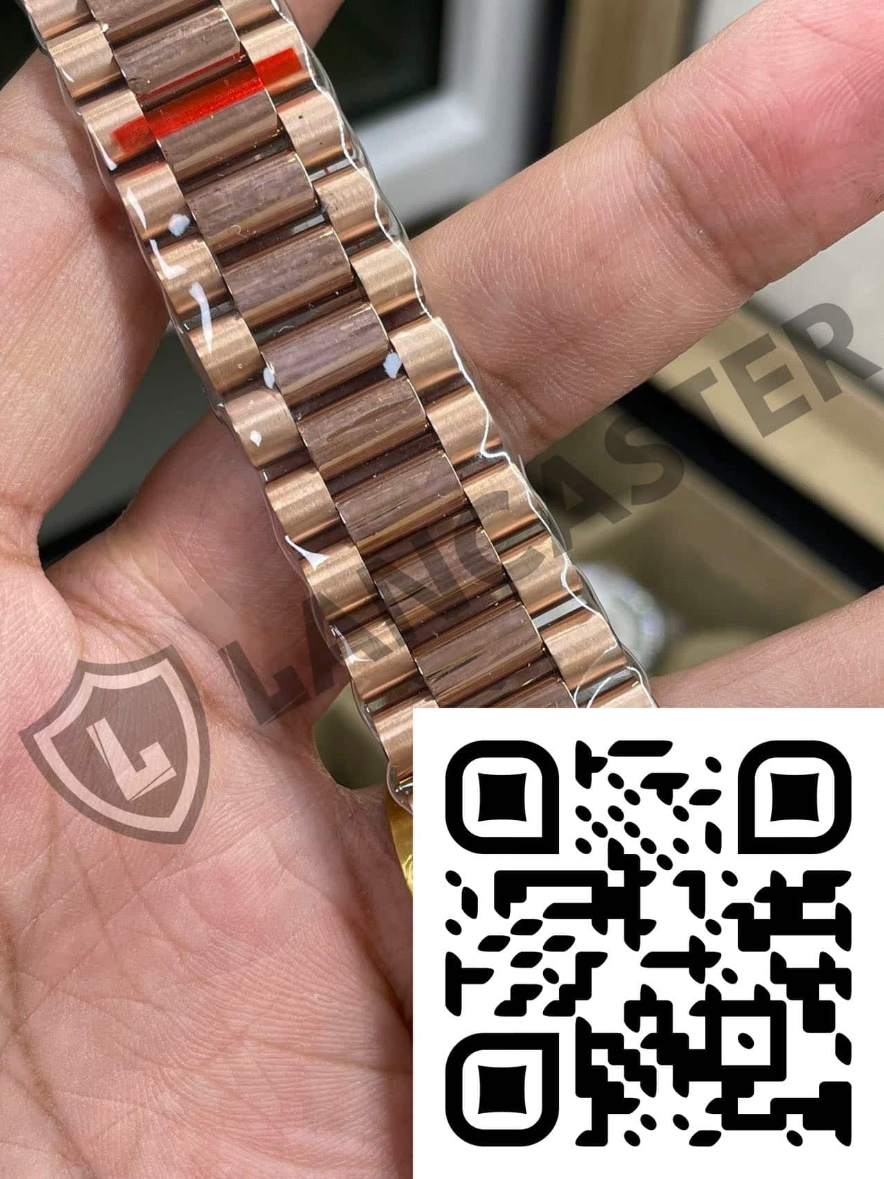a hand holding a watch