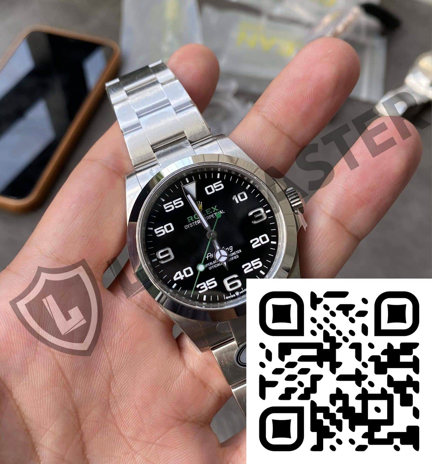 a hand holding a watch