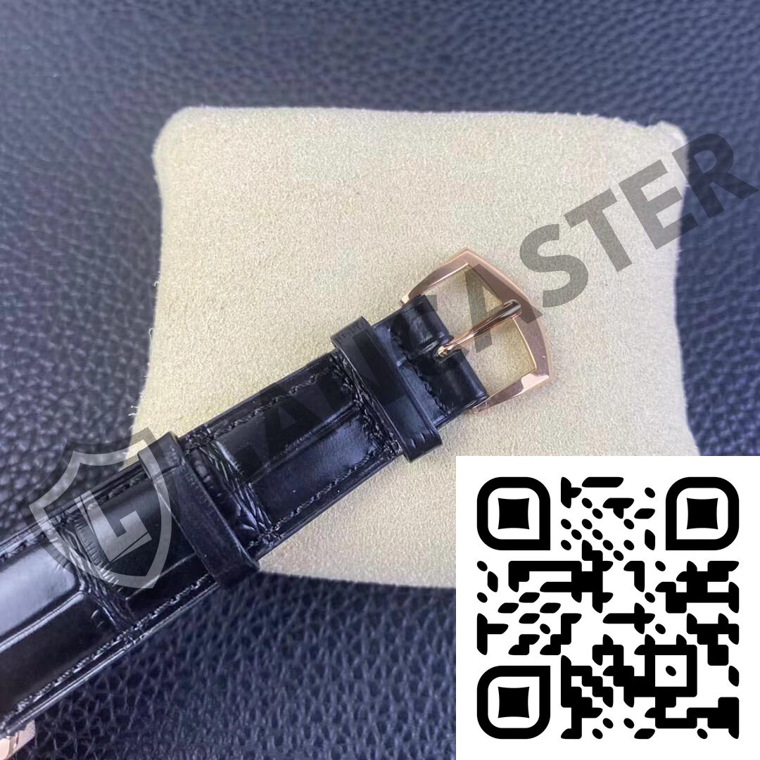 a black watch strap on a white pillow