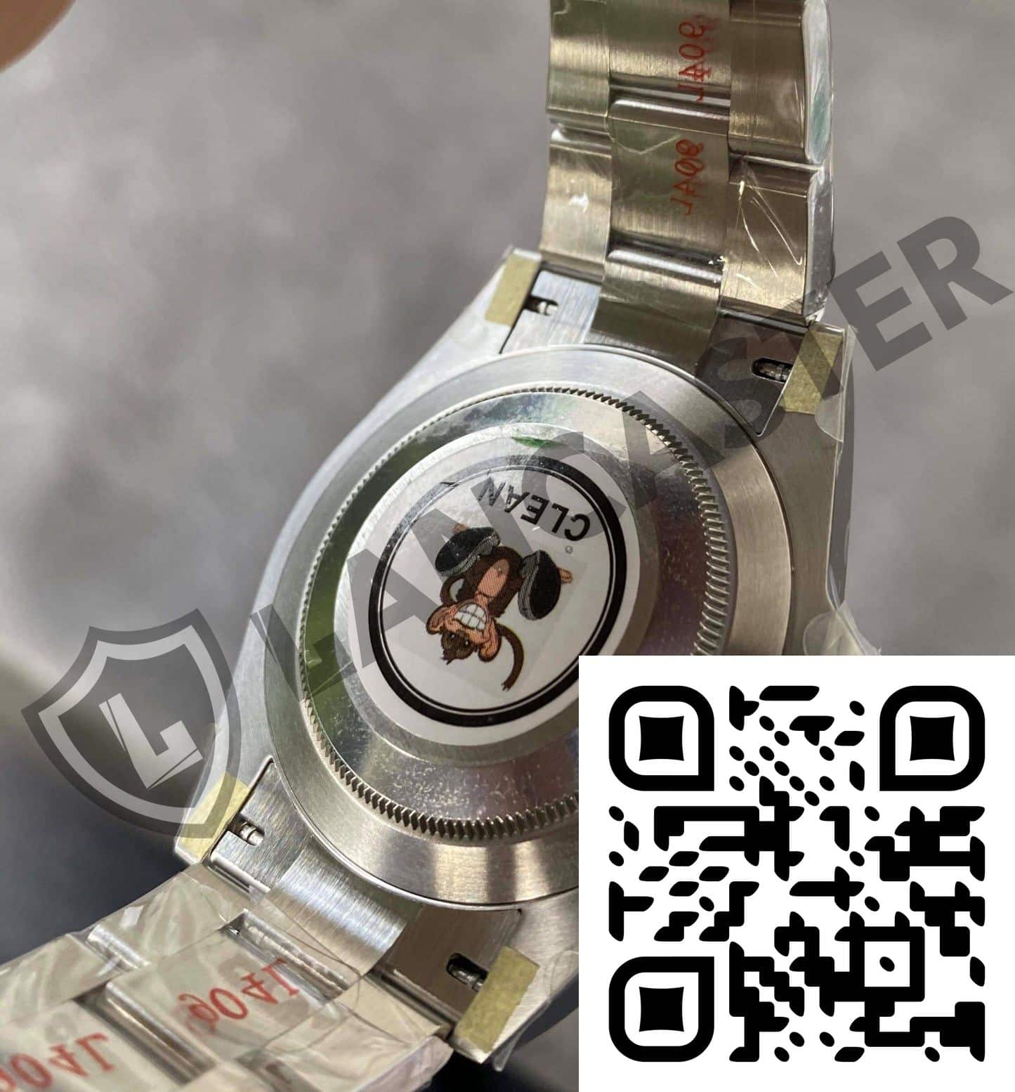 a qr code on a silver watch