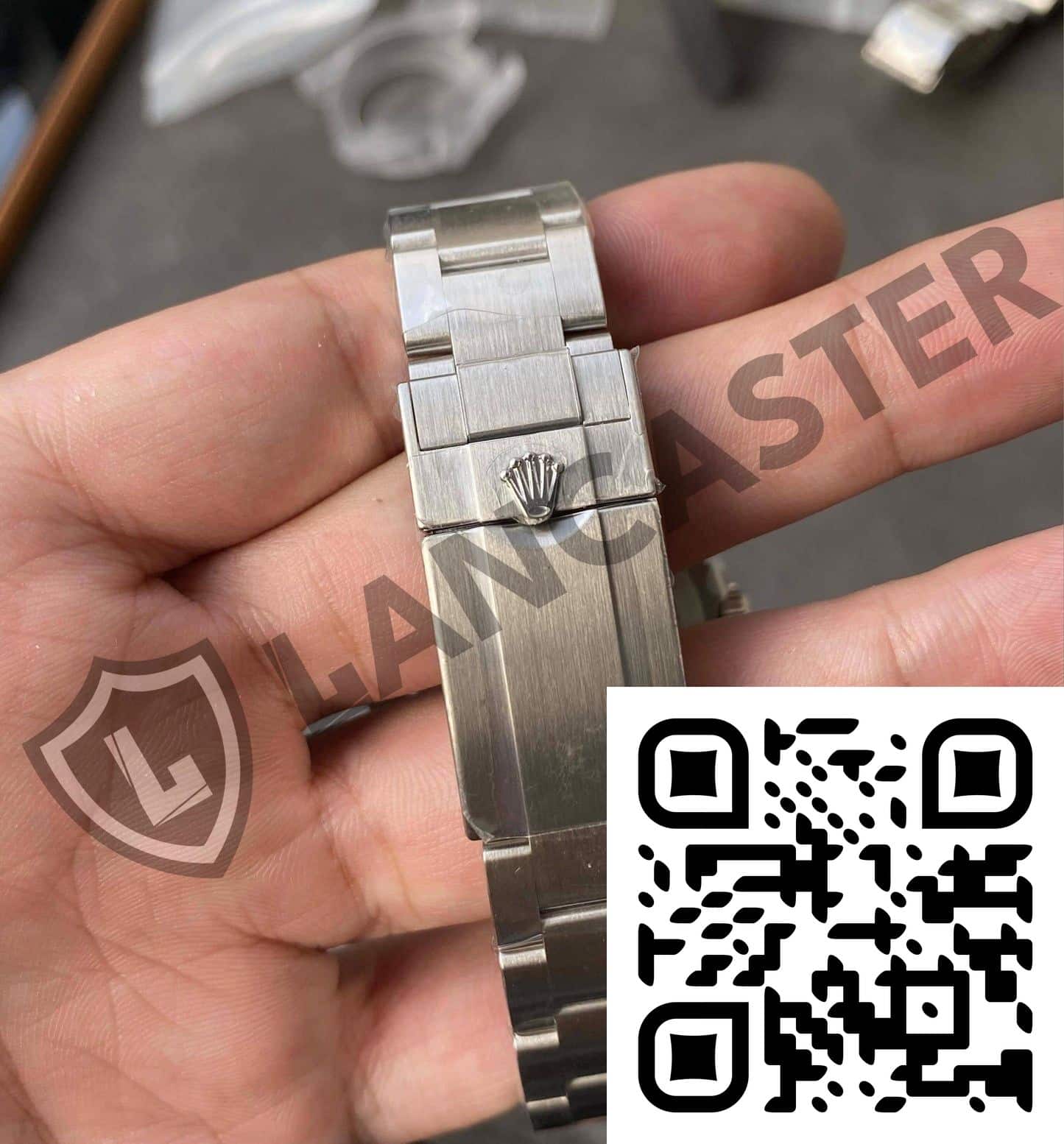 a hand holding a watch