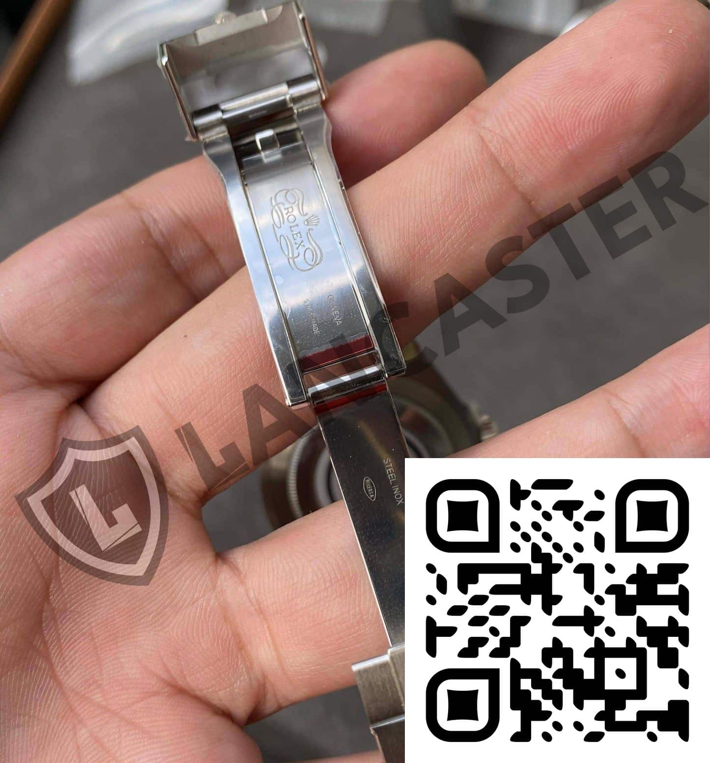 a hand holding a watch