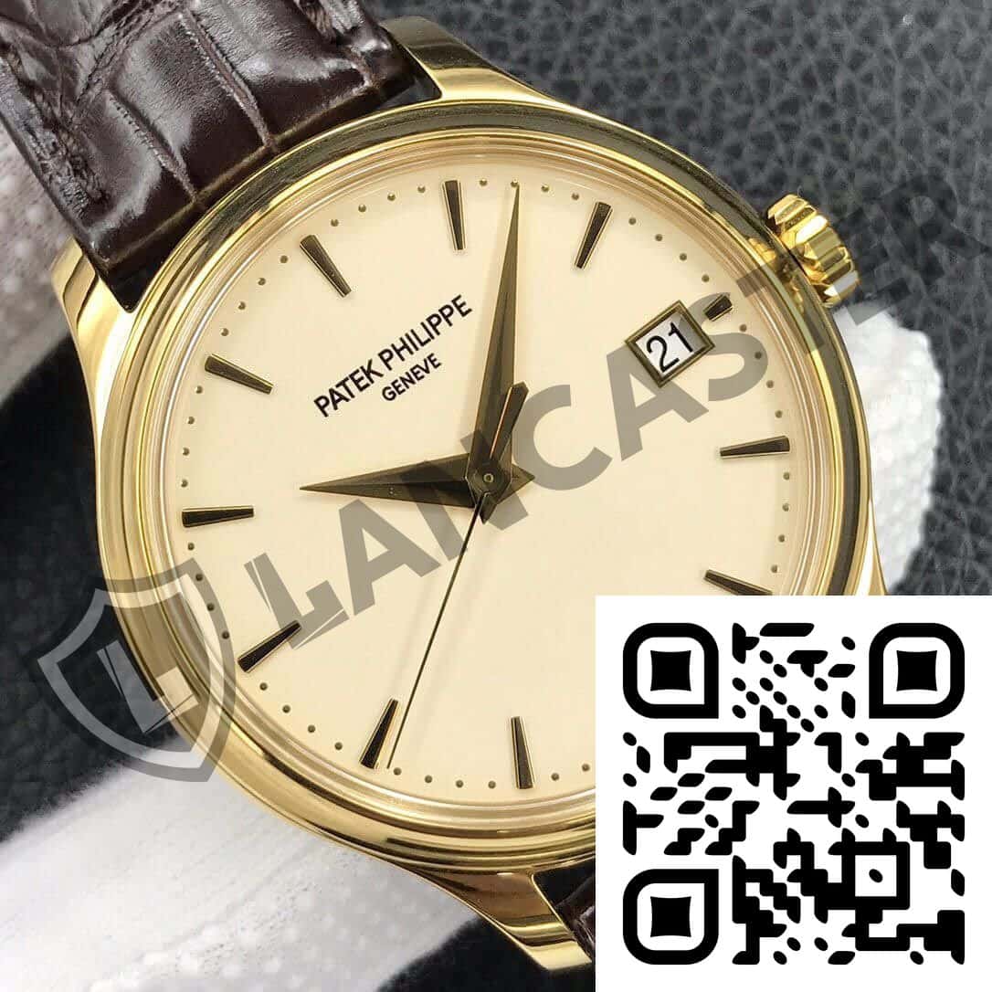 a gold watch with a brown leather strap