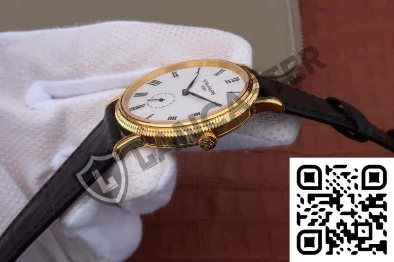 a hand wearing a gloved hand holding a watch