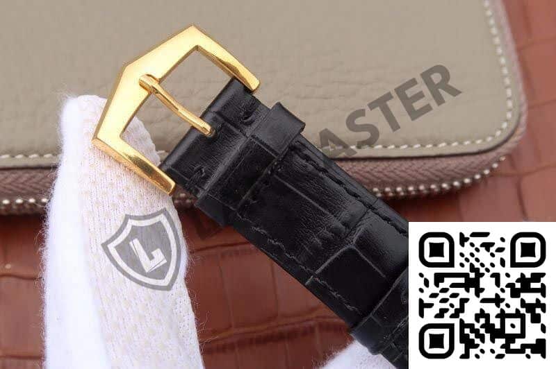a black leather strap with a gold buckle